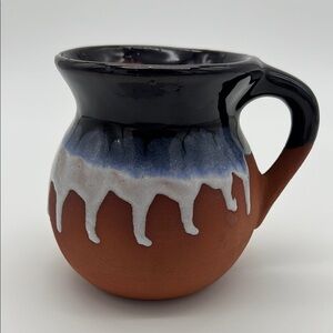 Ornamental Handcrafted Red Clay Mug with Blue and White Glaze in a Drip Pattern